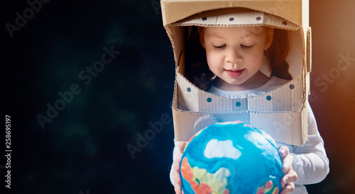 Kid with globe.