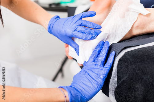 Callus peel, peeling feet procedure at beauty salon