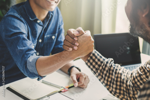 Business hand shaking concept.Businessman handshaking process after successful deal of business meeting,Close up image handshake of business partnership