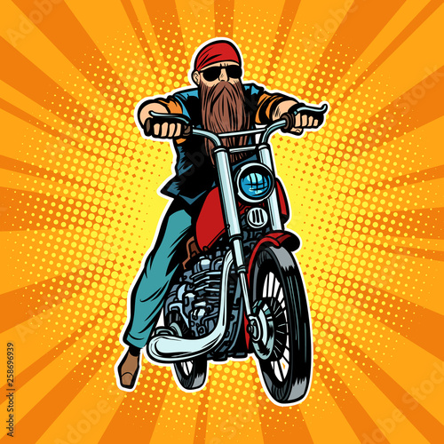 Biker bearded man on a motorcycle