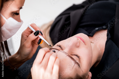 Permanent make up on eyebrows at beauty salon