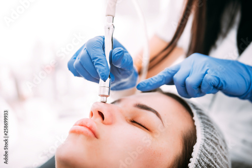 Professional skin care  procedure Microdermabrasion of the facial skin at cosmetic clinic