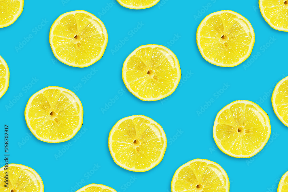Sliced juicy lemon on a blue background. Fresh fruits. Fruit background. Sliced juicy lemon on a blue background. Fresh fruits. Fruit background.