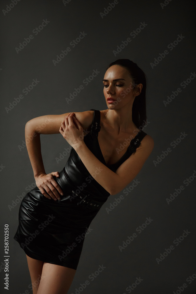The girl in the leather dress.Model look.