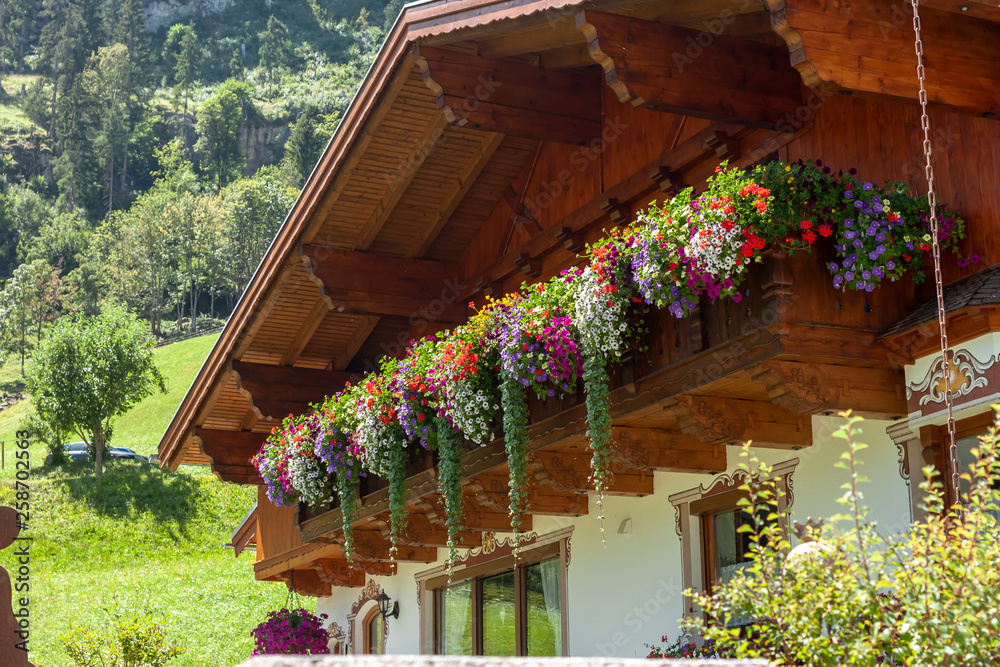 traditional chalet decorated with flowers summer time