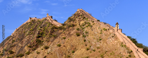 ancient watchtower in the great indian wall overlooking the city of Amer near to the Amber Fort, Radjasthan, Jaipur, India  photo