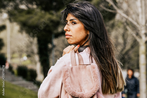 Attractive young woman enjoying her time outside in park