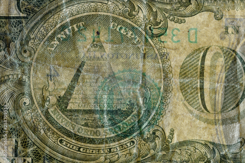 The Great Seal pyramid, highly magnified surface of used 1 dollar banknote with visible details of cotton fiber paper, with all flaws, watermarks and traces of usage.