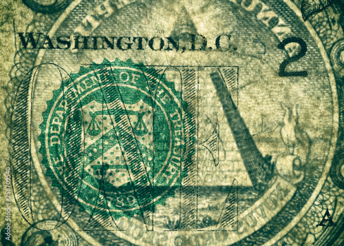 Banknote s skin. The Department of the Treasury Seal and the pyramid  highly magnified surface of used 1 dollar banknote with visible details of cotton fiber paper  with all flaws  watermarks and trac