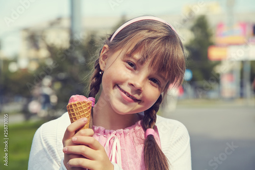 portrait of a girl. child eating ice cream