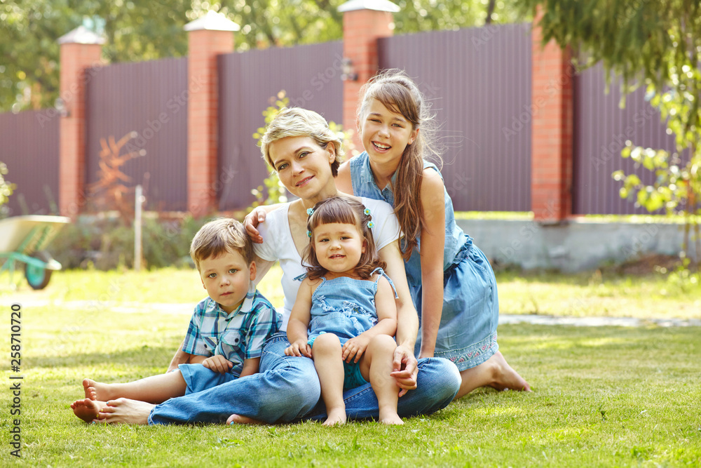 playful family outdoors. mom with children in the summer. Mother and kids