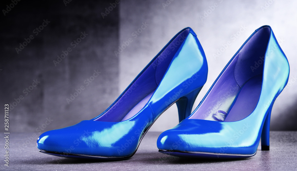 Composition with a pair of blue high heel shoes Composition with a pair of blue high heel shoes