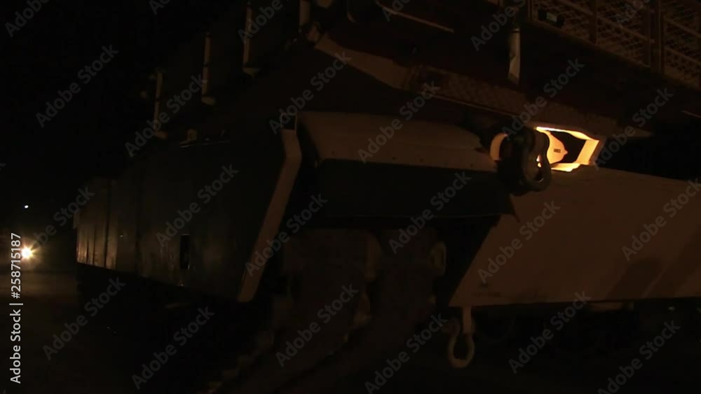 M1 Abrams tank stopping in the desert at night M1 Abrams tank stopping in the desert at night
