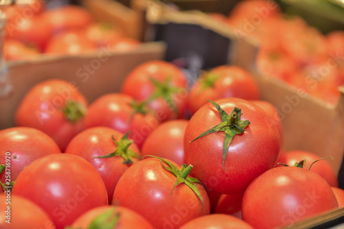 Red tomatoes in cardboard box