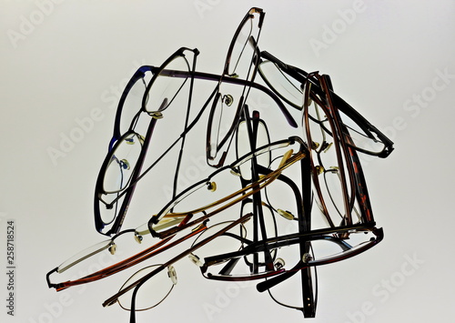 A color image of discarded eyeglasses with a white background. photo