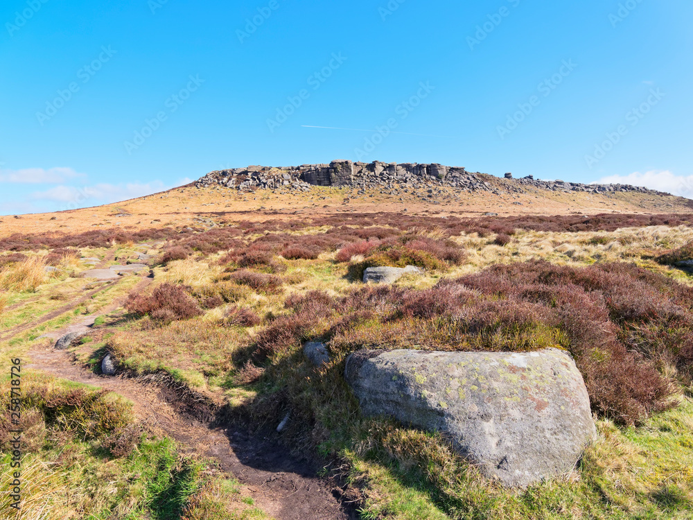 Across the Derbyshire moors to a distant Higger Tor on a bright spring morning.