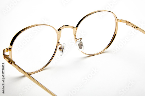 Golden border glasses on white background