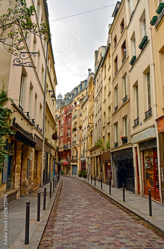 Latin Quarter of Paris, France. Narrow cobbled street among old traditional parisian houses in Paris. © MarinadeArt