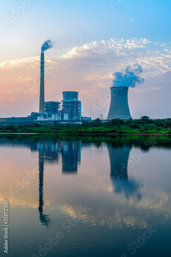 At dusk, the thermal power plants , tops of cooling towers of atomic power plant