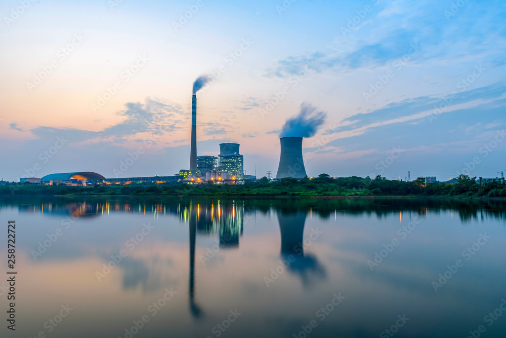 At dusk, the thermal power plants , tops of cooling towers of atomic power plant At dusk, the thermal power plants , tops of cooling towers of atomic power plant