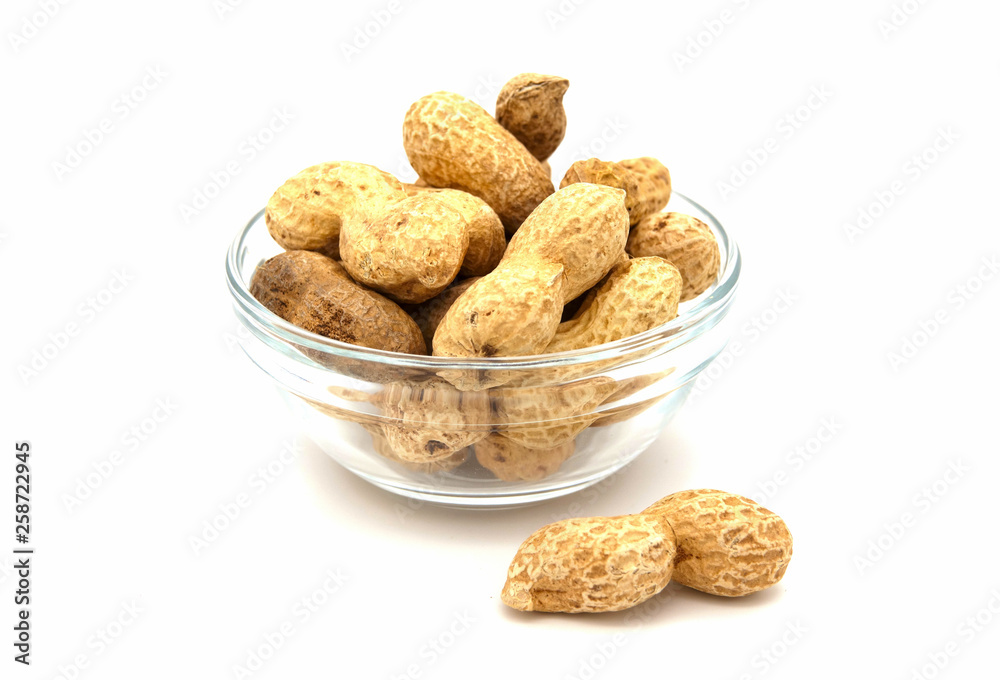 peanuts in a bowl isolated on white background peanuts in a bowl isolated on white background