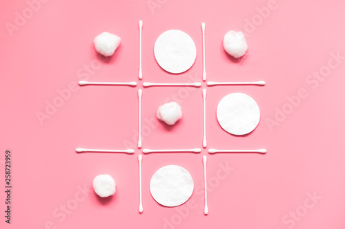 Tic tac toe game made from cotton pads, swabs, balls. Hygiene, makeup removal concept.