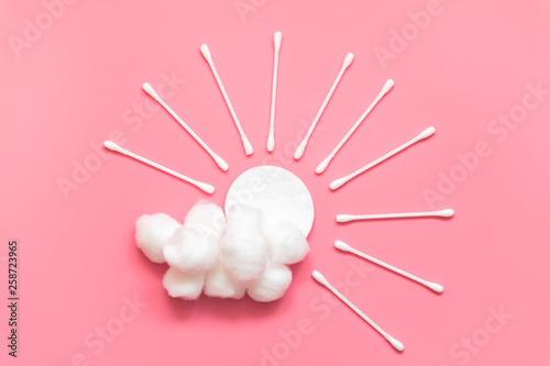 Sun with beams and cloud made from cotton pad and swabs. Hygiene, morning skin care routine.