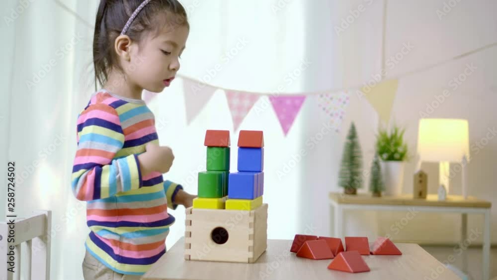 Kid's creativity, Child little asian girl playing colorful building blocks on the desk in the class room at home, Educational concept for school Kid's creativity, Child little asian girl playing colorful building blocks on the desk in the class room at home, Educational concept for school