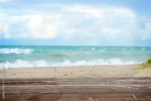 wood table with tropical summer ocean seascape background