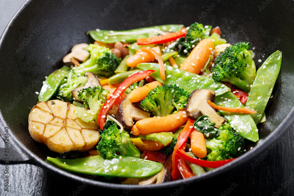 stir fried vegetables in a wok stir fried vegetables in a wok