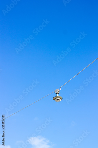 Old vintage street lamp hanging above the street in the Helsinki