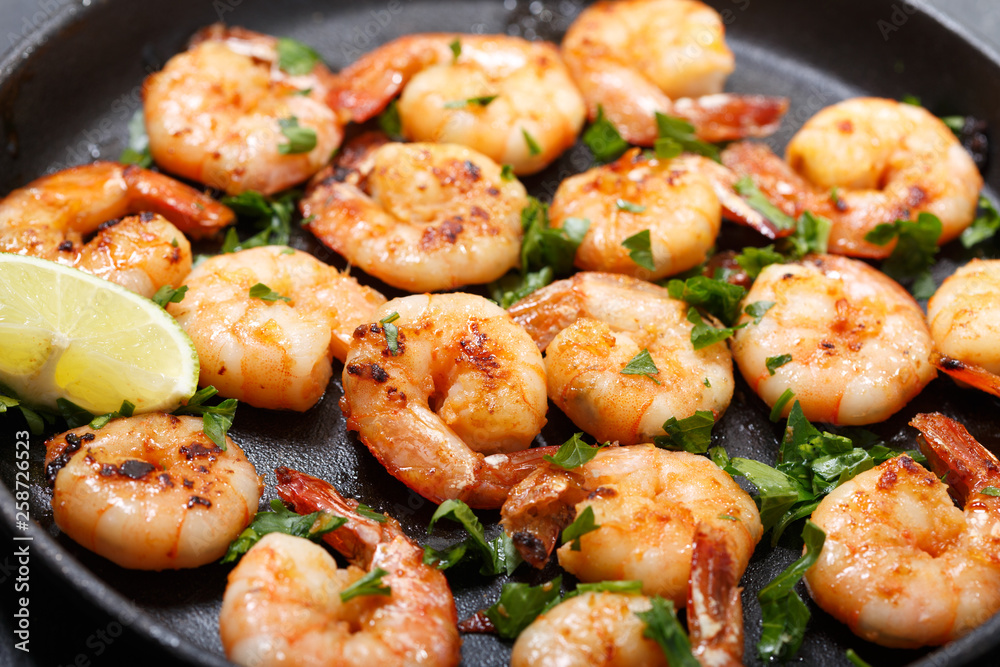 pan of grilled shrimps with lime pan of grilled shrimps with lime