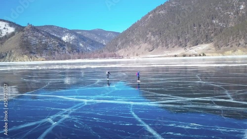 Tourists on the ice from aerial view. Winter in Siberia, Baikal Lake.