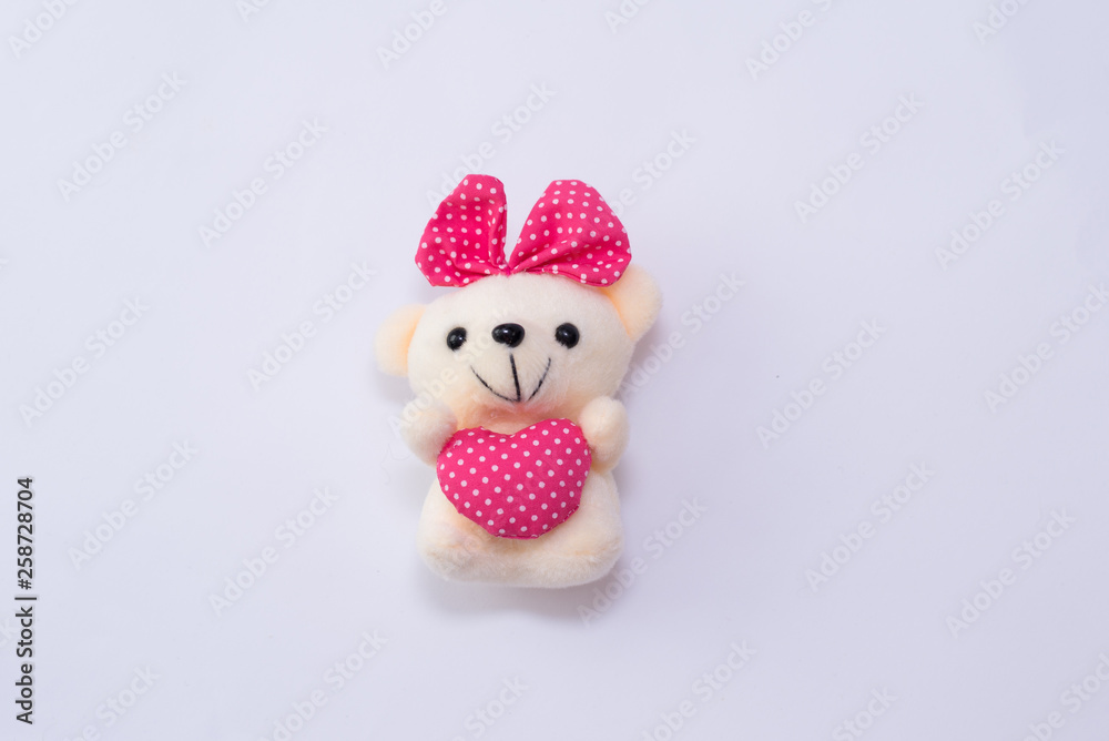children's soft toy teddy bear girl with heart isolated on white background children's soft toy teddy bear girl with heart isolated on white background