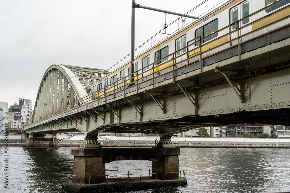 local City Train running on the Bridge over Sumida River, Tokyo, Japan local City Train running on the Bridge over Sumida River, Tokyo, Japan