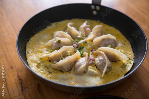 Fried egg dumplings in a frying pan