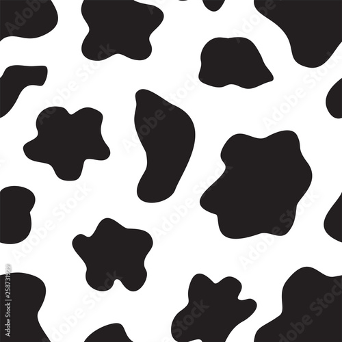 Beautiful pattern of cow skin. Seamless background with random black elements. Animal ornament.