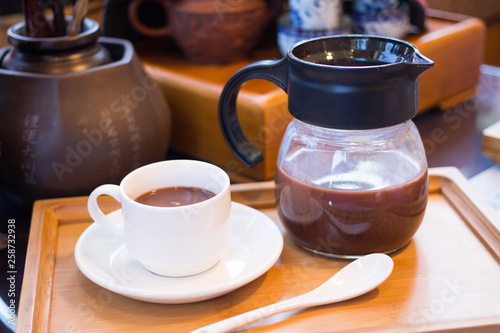 hot dark milk chocolate cup with teapot
