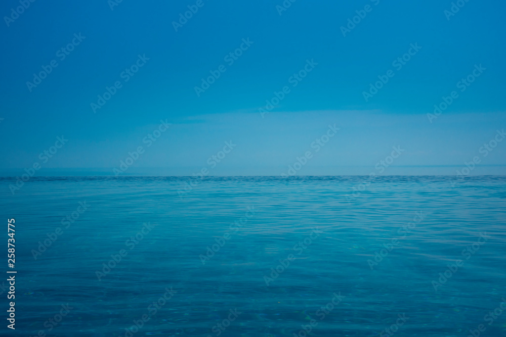 Summer background ocean view blue sky with swimming pool.