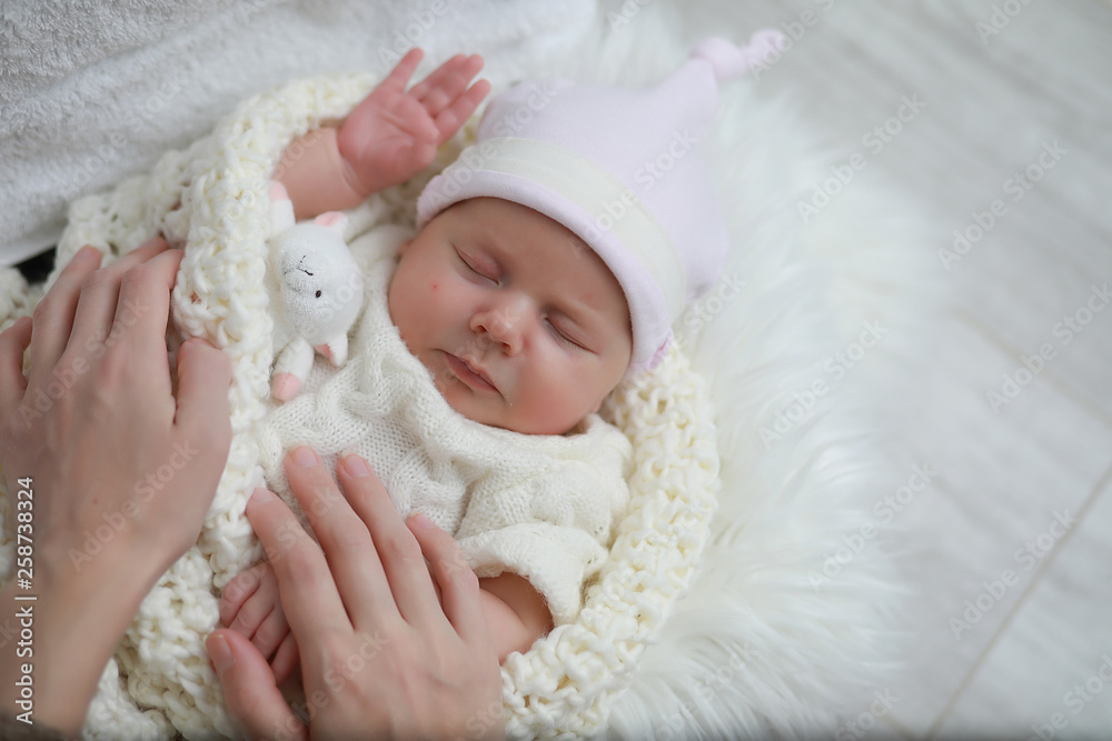 Baby newborn sleeping wrapped up in a blanket Baby newborn sleeping wrapped up in a blanket