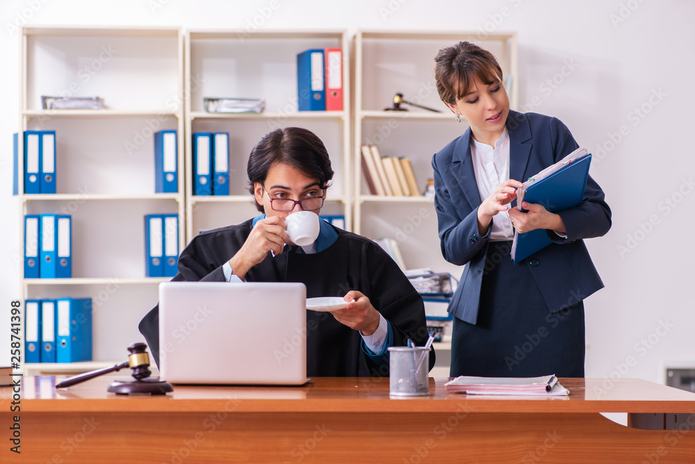 Two lawyers working in the office Two lawyers working in the office