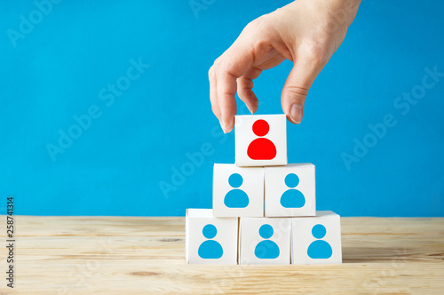 Принти на полотні Hand arranging block stacking on top with human symbol with wooden table