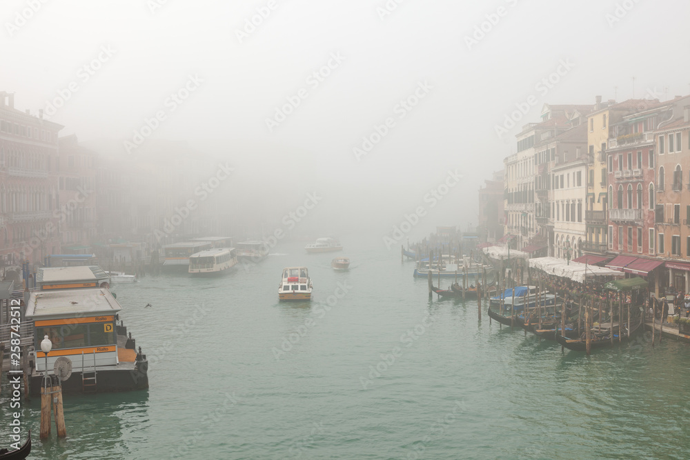 Grand Canal (Canal Grande). Foggy view from brige of Rialto