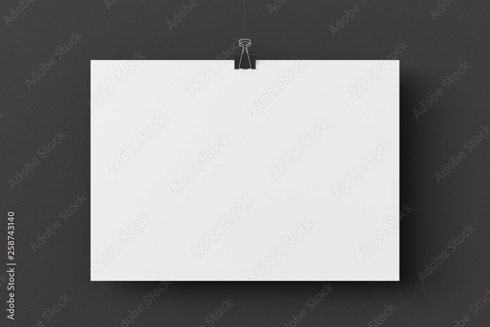 Blank paper poster hanging on binder clip Blank paper poster hanging on binder clip
