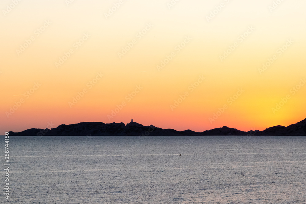 sunset over the mediterranean sea and the castle of If, Marseille