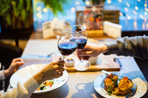 Man and woman drinking red wine in the restaurant