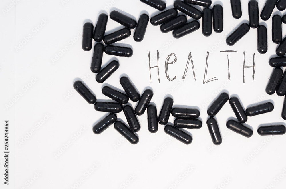 Medical black pills in a circle Medical black pills in a circle