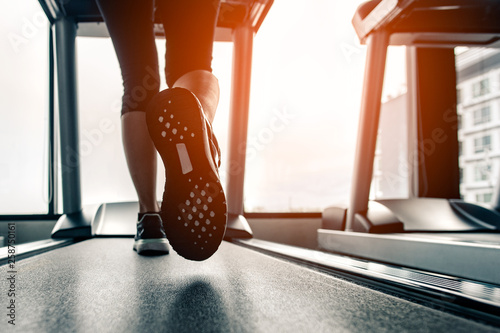 Close up on shoe,Women running in a gym on a treadmill.exercising concept.fitness and healthy lifestyle