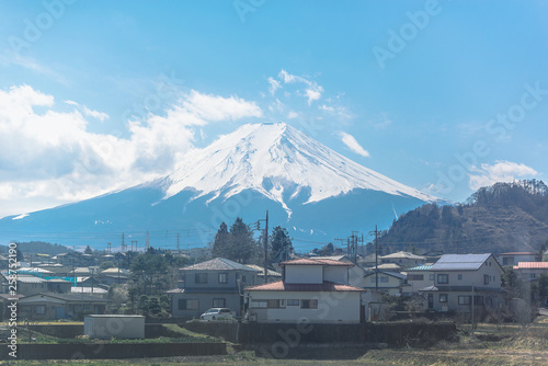 Photography View from train window with Mount Fuji on blue sky background