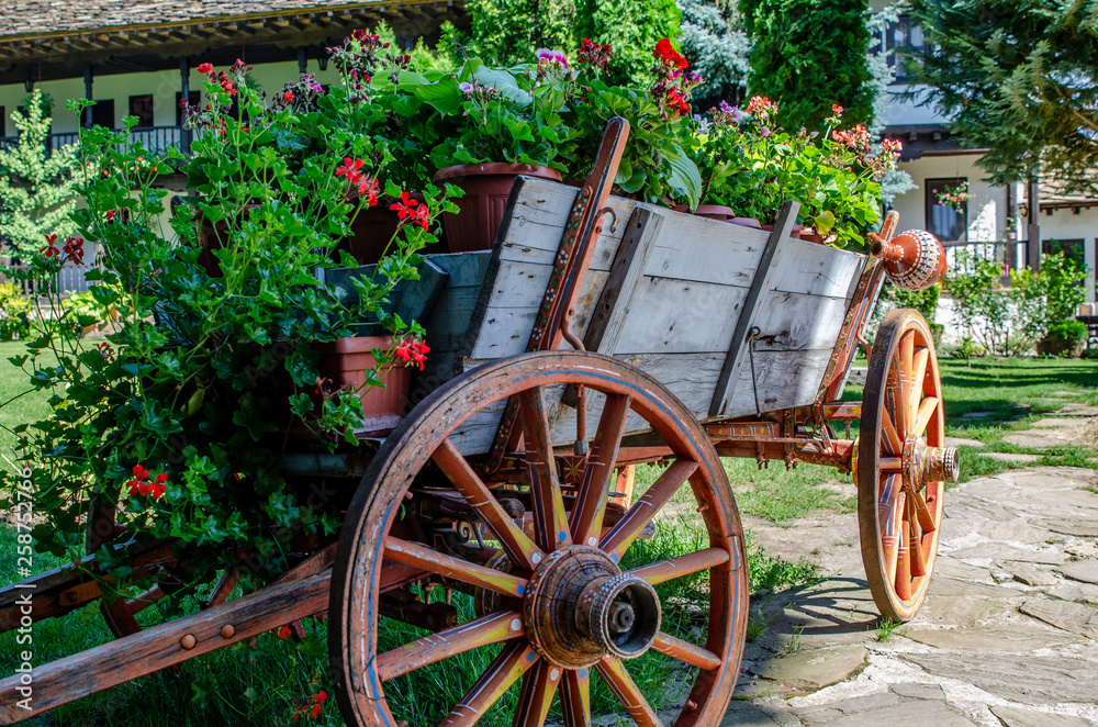old wooden donkey cart used recycled as flower planter